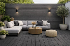 Pack of 4 black outdoor decking boards from Solid Furniture LTD UK installed in a modern garden patio, featuring a sleek, durable finish ideal for UK outdoor spaces