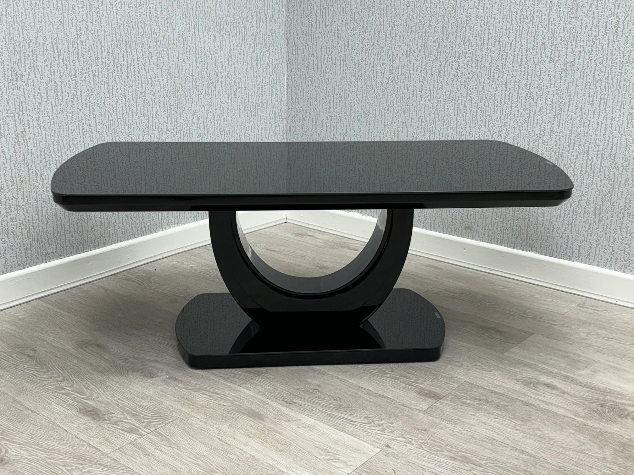 Black Texas coffee table side view with high gloss top and U-shaped base | Solid Furniture UK