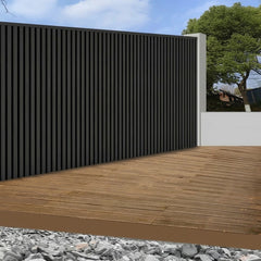 Black waterproof outdoor WPC wall panels 180/290cm installed on a main gate by Solid Furniture UK