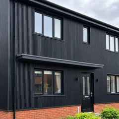 Black waterproof WPC wall panels 180/290cm installed on a house exterior by Solid Furniture UK