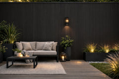 Black WPC outdoor wall panels 180cm and 290cm installed on exterior wall in the UK by Solid Furniture LTD, ideal for patios, balconies, and garden feature walls