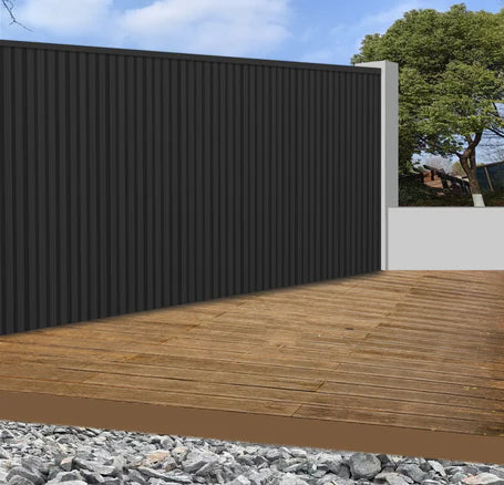 Black WPC outdoor wall panels 180cm and 290cm installed in a modern UK garden setting by Solid Furniture LTD, showcasing sleek and durable exterior wall design