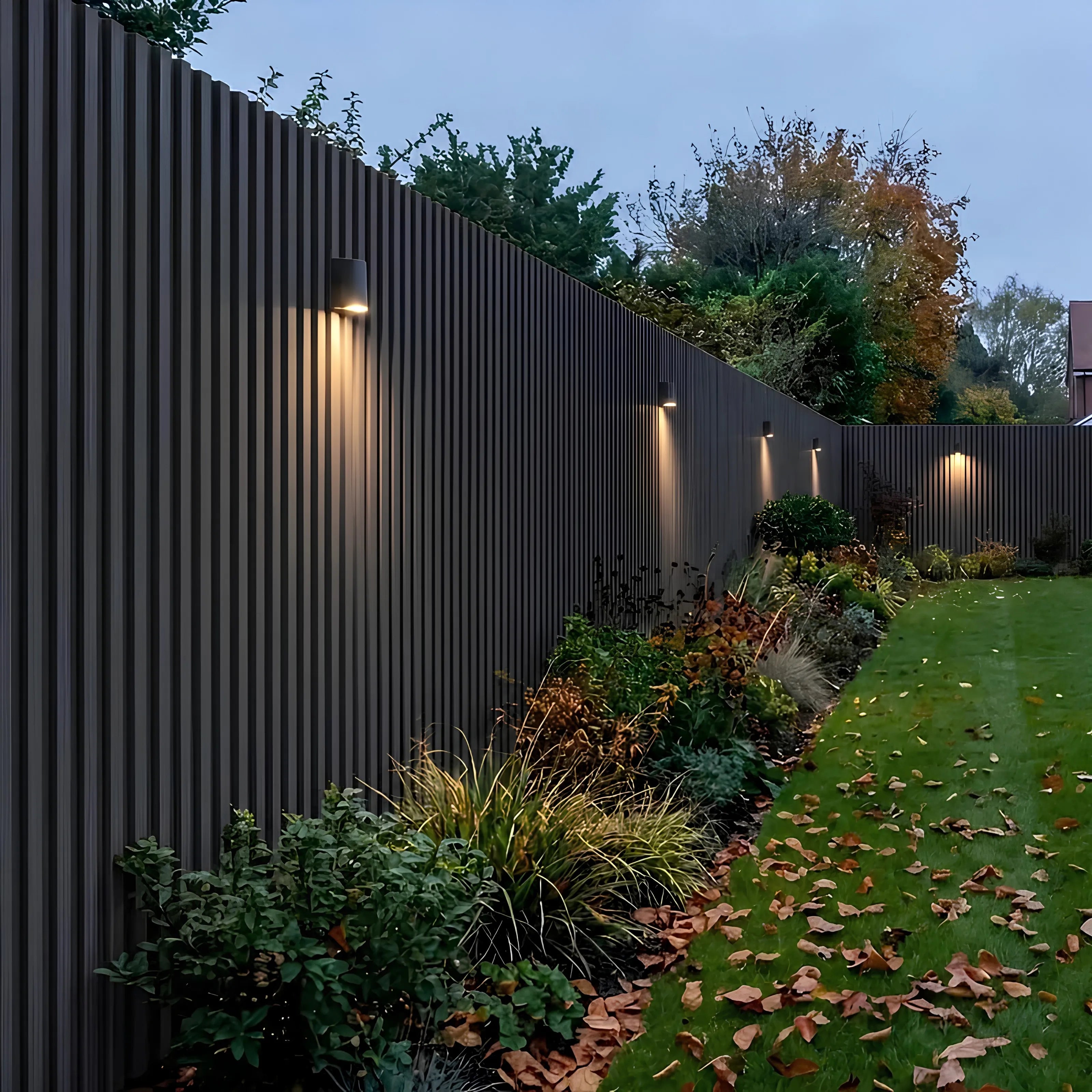 Black WPC wall panels installed in a garden feature area – Solid Furniture UK