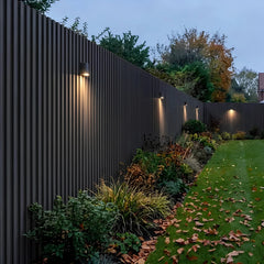 Black WPC wall panels installed in a garden feature area – Solid Furniture UK