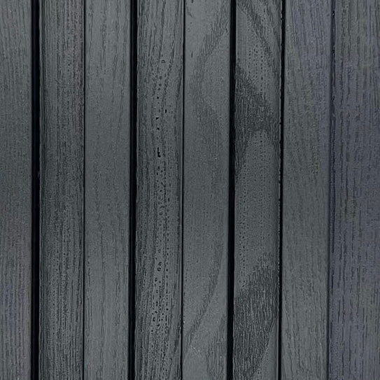 Close-up view of black WPC wall panels from Solid Furniture UK showing waterproof structure, durable composite material, and smooth surface finish for modern interior wall cladding.