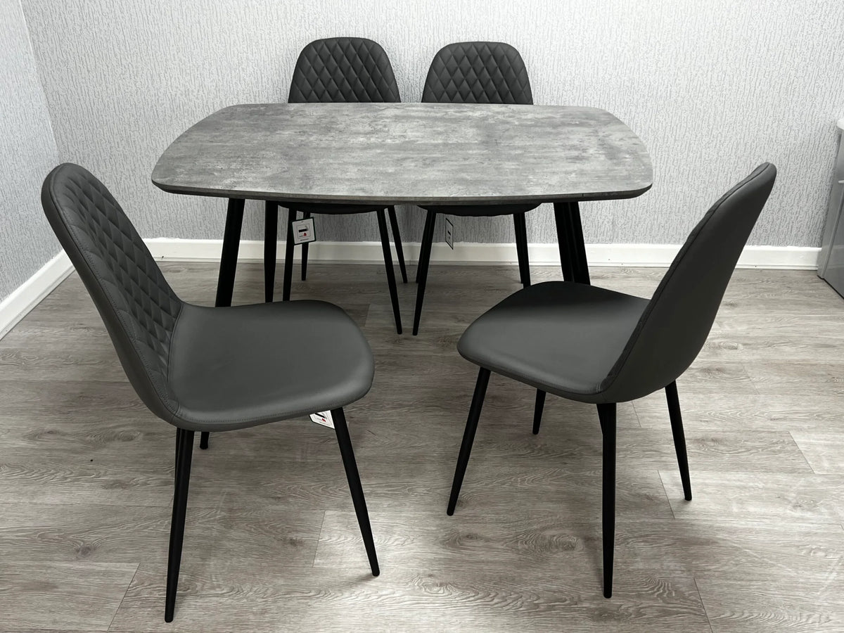 Side view of Boston 4-seater dining set featuring faux marble table top and 4 matching chairs, highlighting table structure and chair design from Solid Furniture UK.
