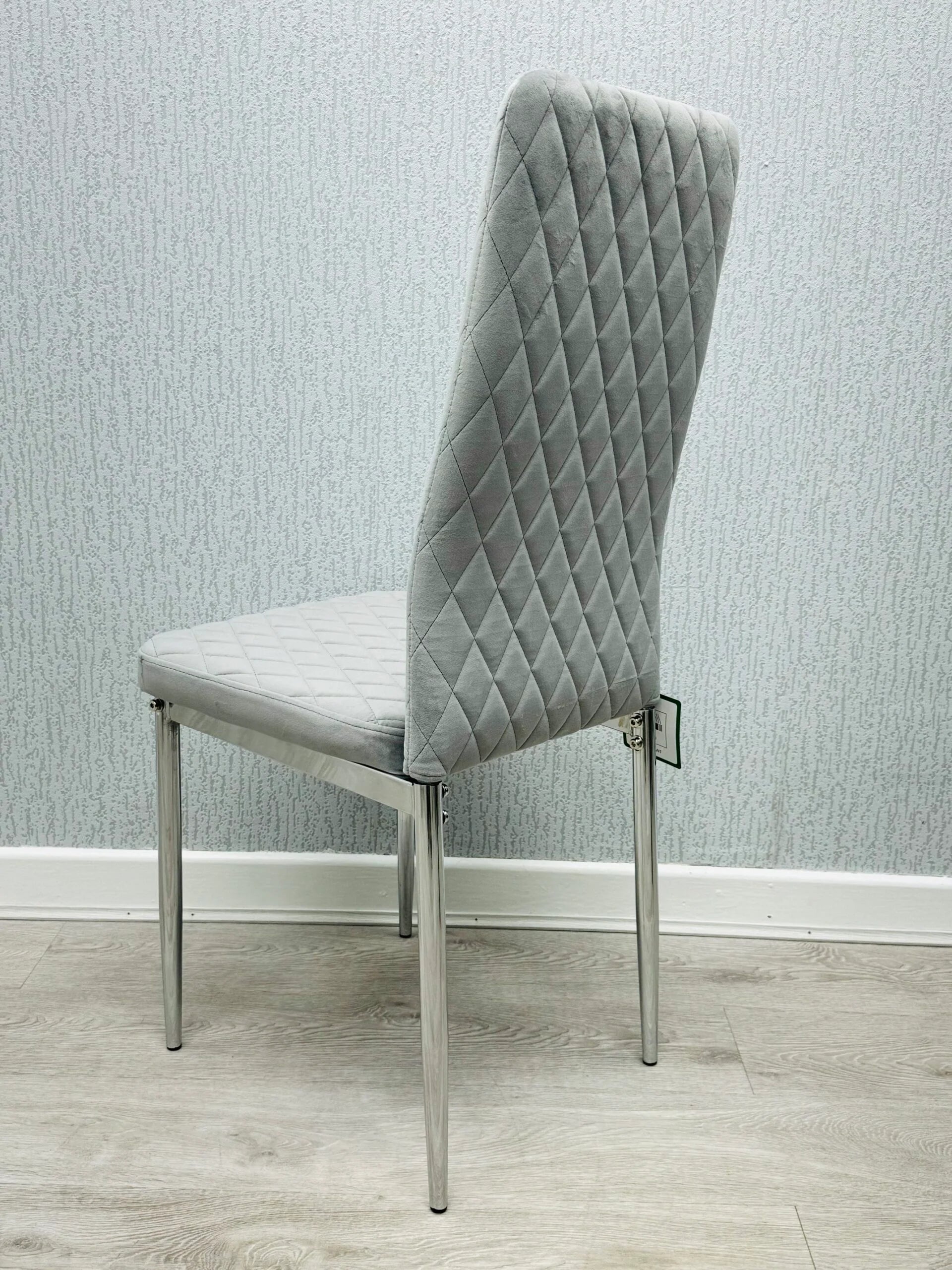 Side view of California light grey velvet dining chair showing chrome legs and slim modern profile set of 4 by Solid Furniture UK