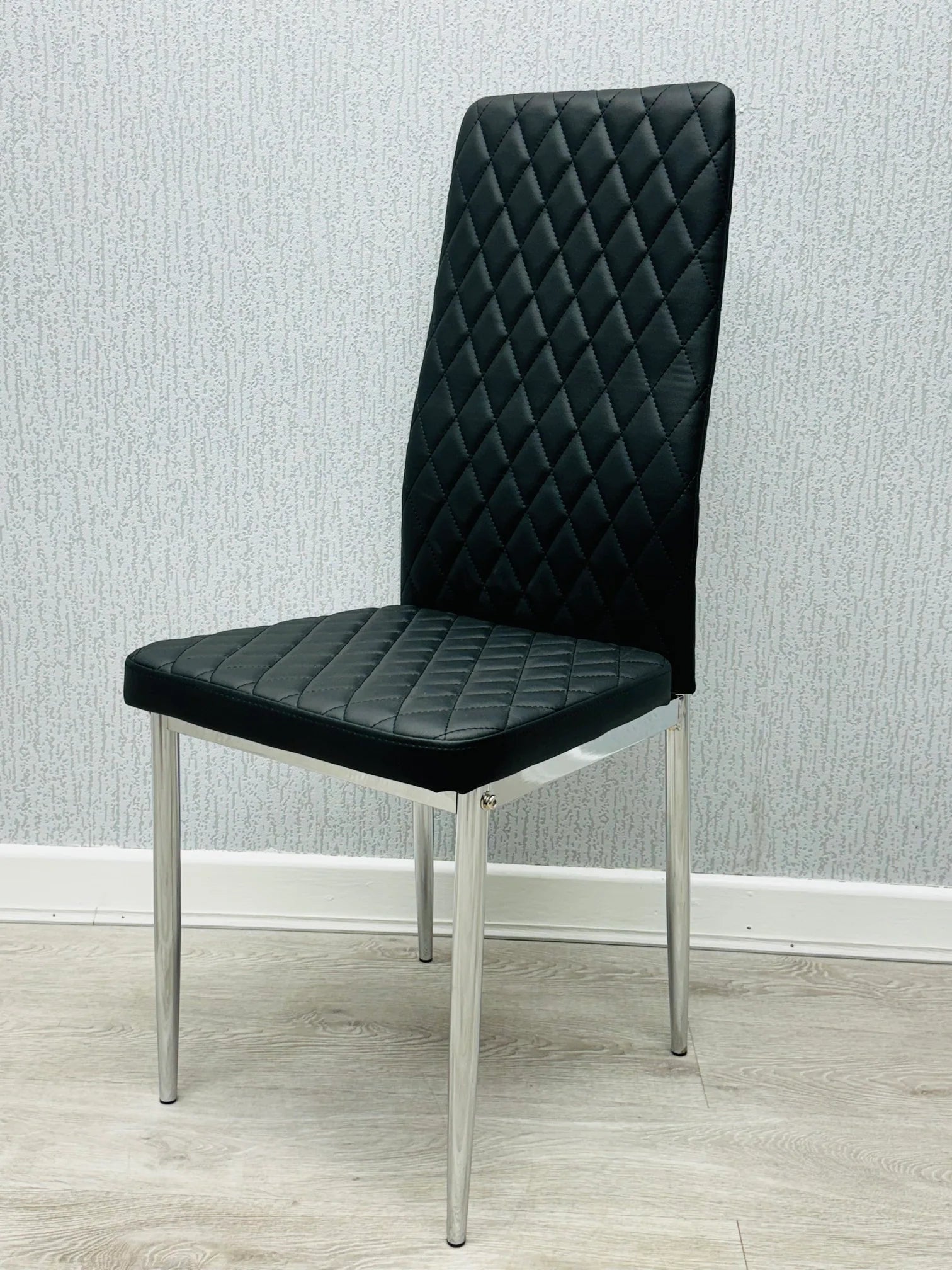 Black California PU Dining Chair front view with sleek faux leather finish and chrome legs by Solid Furniture UK