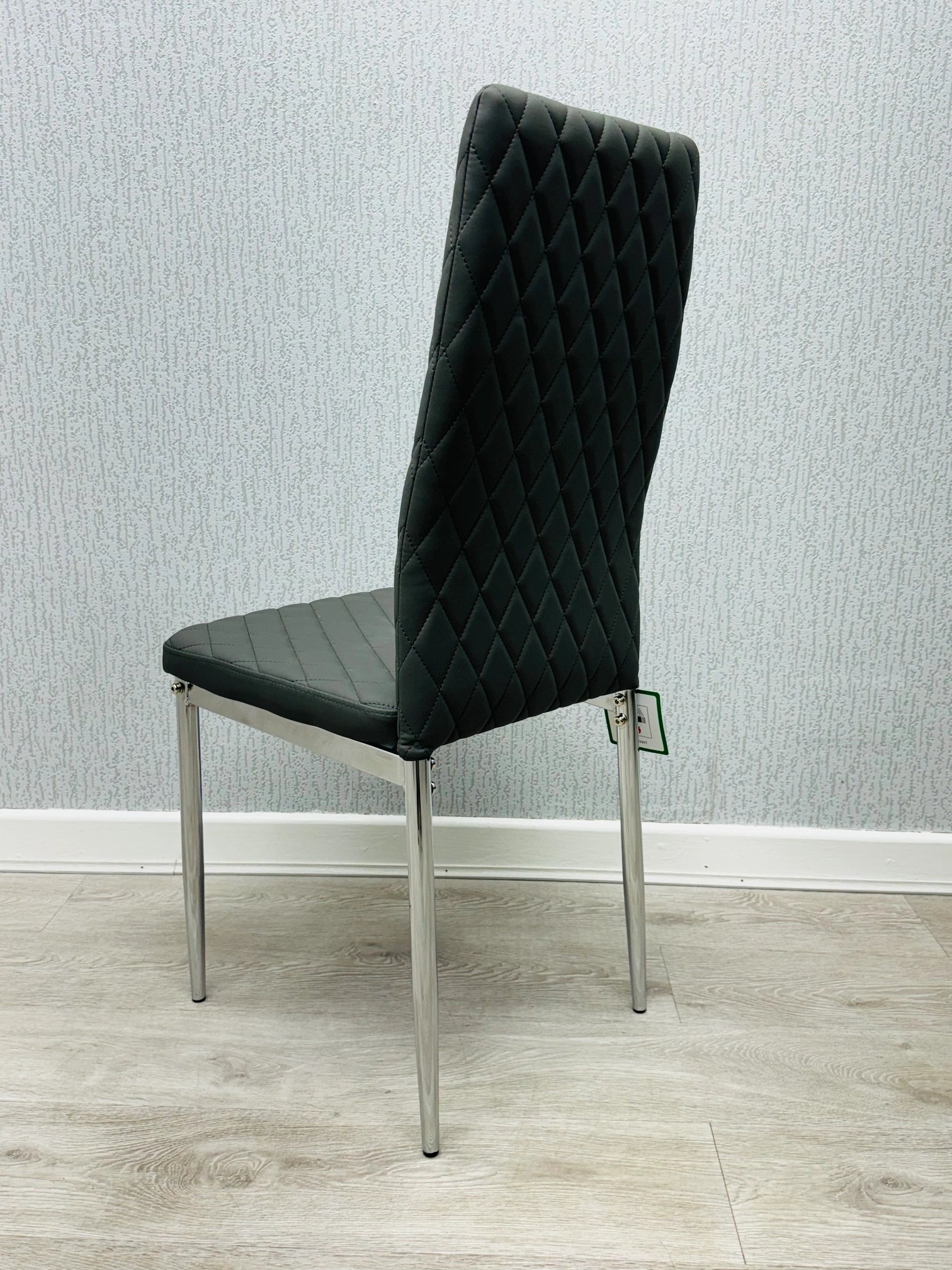 Rear view of grey California PU Dining Chair showing ergonomic design and chrome base by Solid Furniture UK