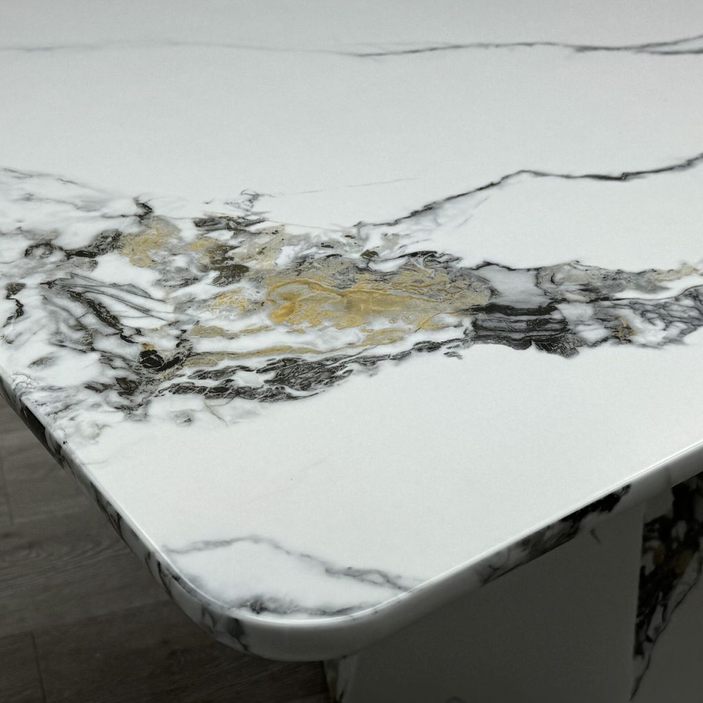 Angled view of Capri grey and white marble effect dining table highlighting modern design, marble effect surface and contemporary style solid furniture UK