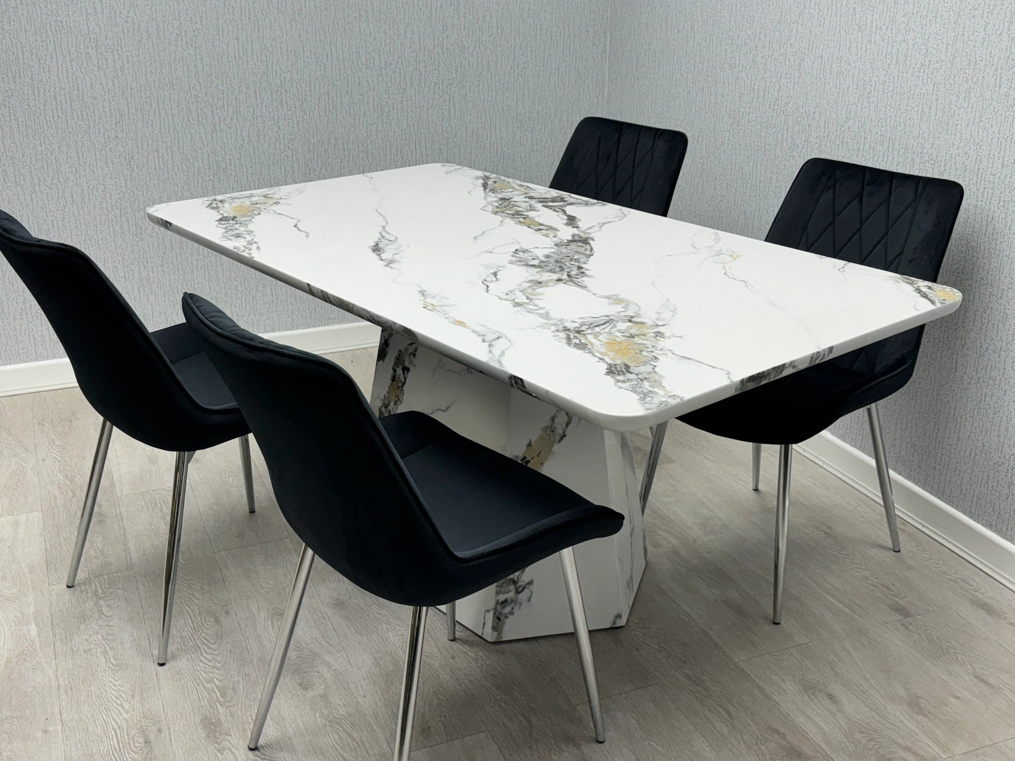 Capri grey and white marble effect dining table with dining chairs showing modern UK dining room setup for family dining and entertaining guests solid furniture UK