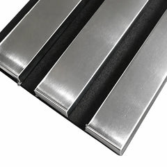 Close-up of chrome 3-sided acoustic slat wall panel 32 x 240 cm showing slat texture, spacing, and grey felt backing for acoustic absorption solid furniture UK