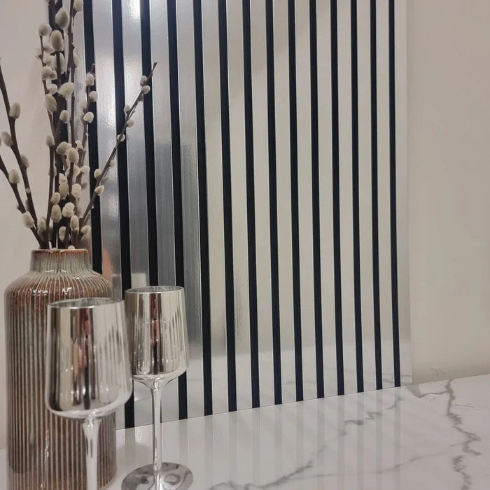 Front-facing view of chrome 3-sided acoustic slat wall panel 32 x 240 cm highlighting seamless edges, shadow lines, and uniform chrome sheen solid furniture UK