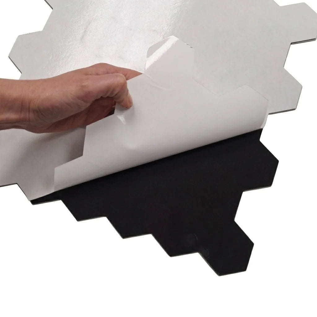 Peel-and-stick backing of chrome hexagon mosaic wall tiles 30 x 30cm pack of 10 by Solid Furniture LTD showing easy self-adhesive installation