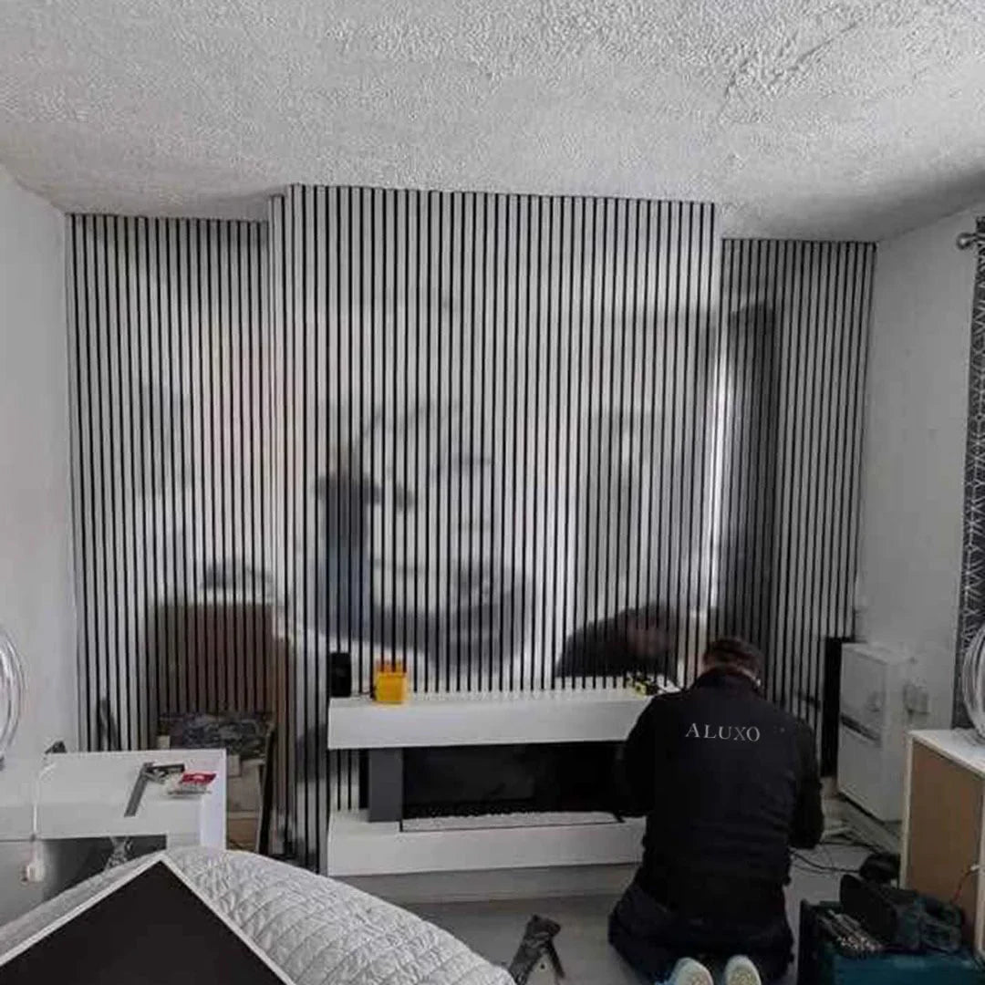 Full wall installation of 60x240cm Chrome Metallic Acoustic Wall Panels by Solid Furniture LTD creating a sleek, reflective feature wall