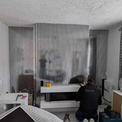 Full wall installation of 60x240cm Chrome Metallic Acoustic Wall Panels by Solid Furniture LTD creating a sleek, reflective feature wall