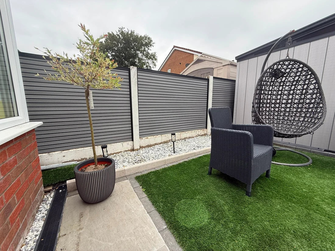 Composite fence panels installed in garden by Solid Furniture UK