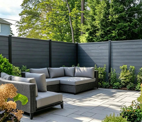 Composite garden fencing professionally installed in a landscaped garden by Solid Furniture UK