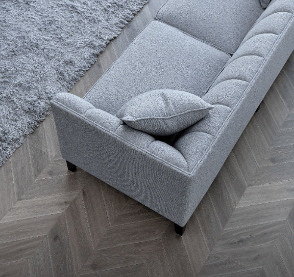 Angled view of Cooper 3 seater sofa in dolphin grey bouclé fabric highlighting minimalist silhouette solid furniture UK