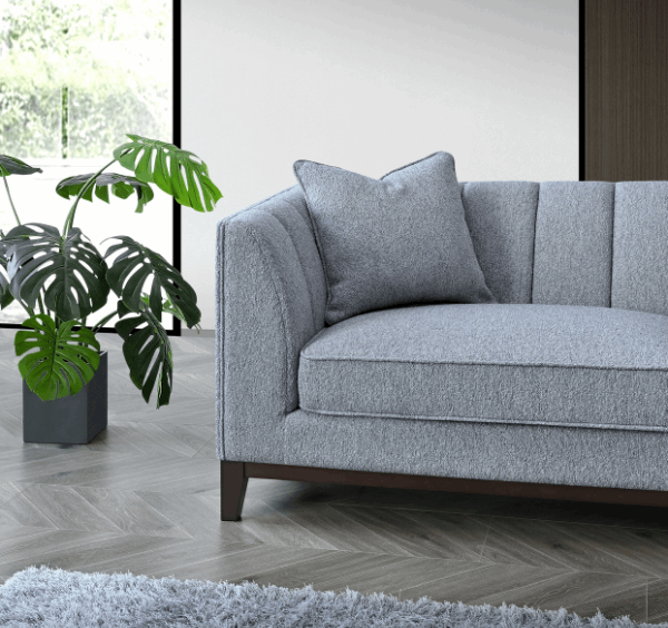 Corner view of Cooper 3 seater dolphin bouclé sofa with mid-century modern design solid furniture UK