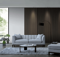Front view of Cooper 3 seater sofa in dolphin grey bouclé fabric with wooden plinth solid furniture UK