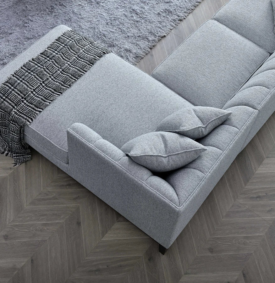 Angled view of Cooper right-hand dolphin bouclé corner sofa solid furniture UK