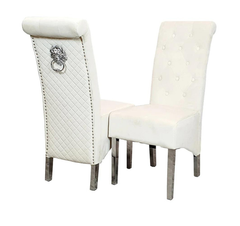 Cream Emma velvet dining chair UK main view featuring quilted button detail, scroll-back design, and chrome lion knocker from Solid Furniture UK.