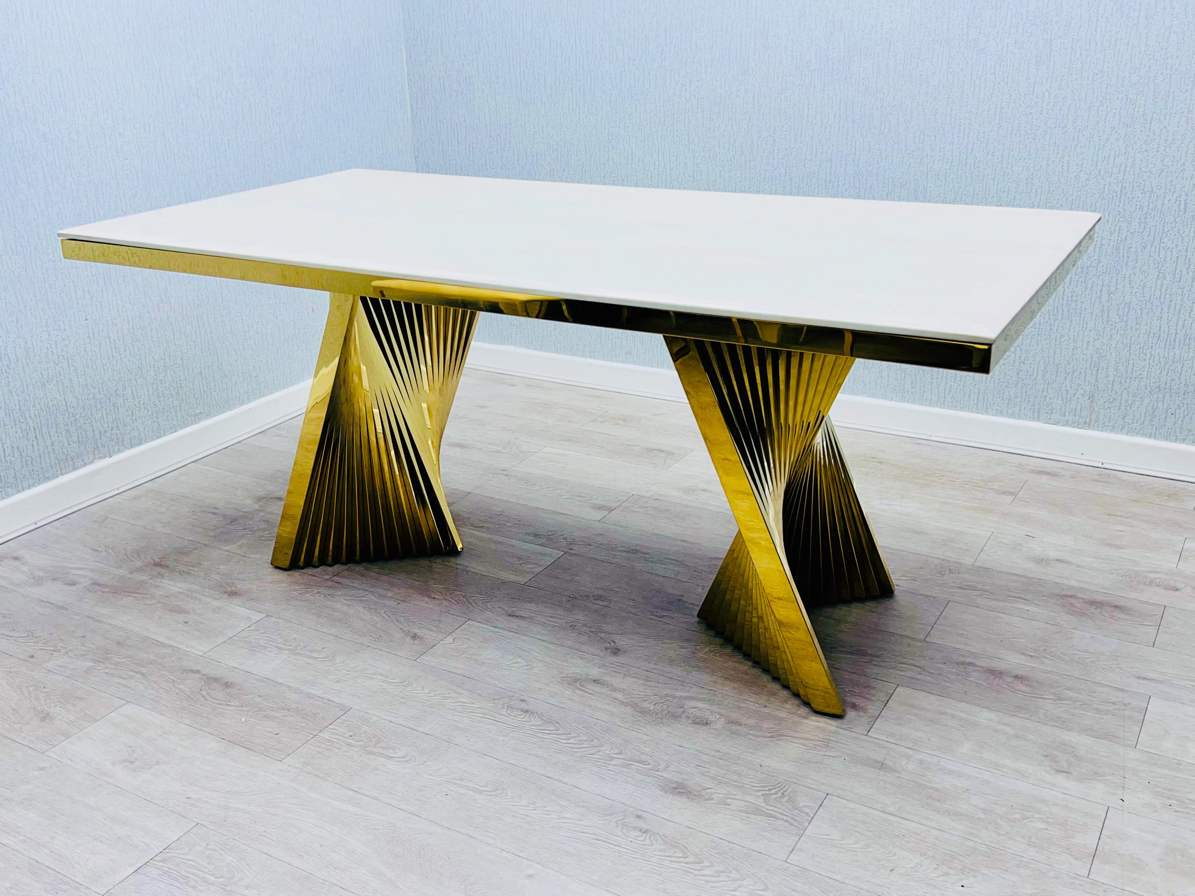 Cream Ravello 160cm dining table with marble-effect glossy top and elegant gold pedestal base, designed to suit modern and luxury dining spaces. solid furniture UK