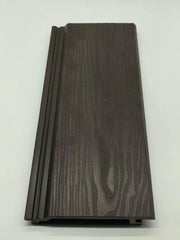 Dark brown exterior composite wall panels with wood grain finish installed outdoors Solid Furniture UK