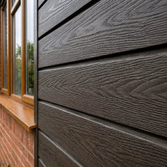 Dark brown waterproof outdoor cladding panels installed on an exterior wall by Solid Furniture UK