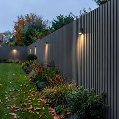 Dark grey seamless WPC wall cladding used on an outdoor garden feature wall – Solid Furniture UK