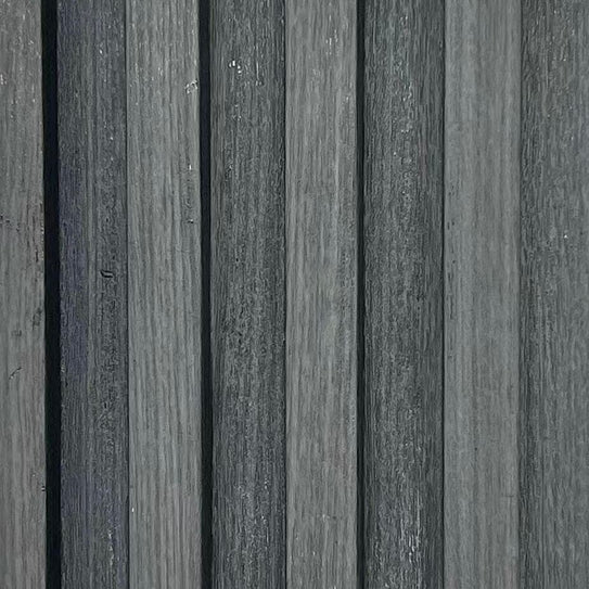 Close-up detail of dark grey WPC wall panel UK by Solid Furniture UK showing stone-effect texture and seamless waterproof surface finish for modern interiors.