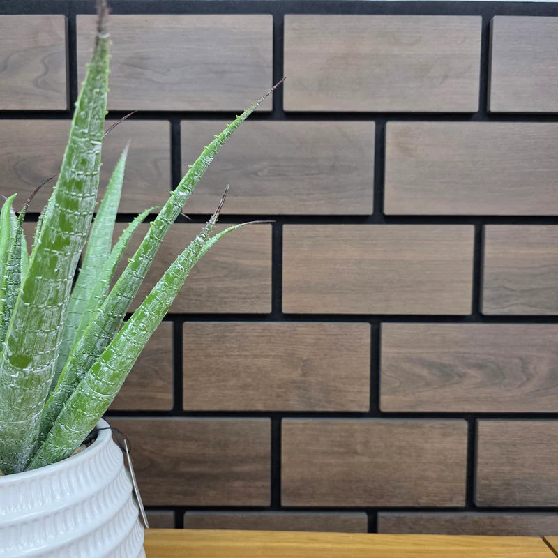 Close-up of 60x240 dark oak brick wall panel UK showing detailed slatted brick pattern, precise spacing, and high-density fiberboard construction. solid furniture UK