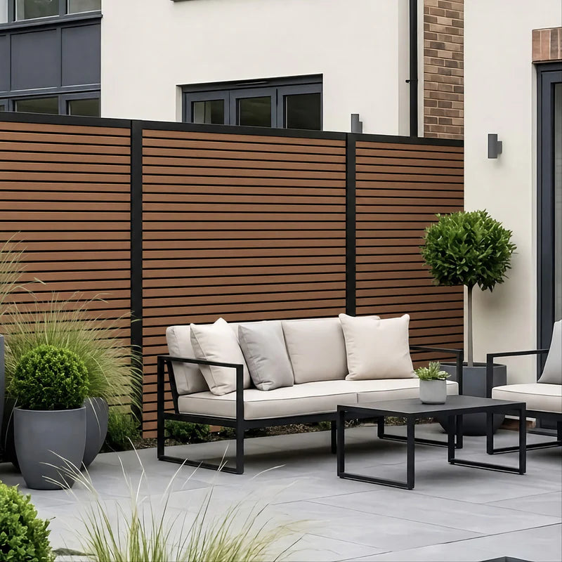 Solid Furniture UK composite fence panels installed in a garden creating a modern, low-maintenance outdoor fencing solution