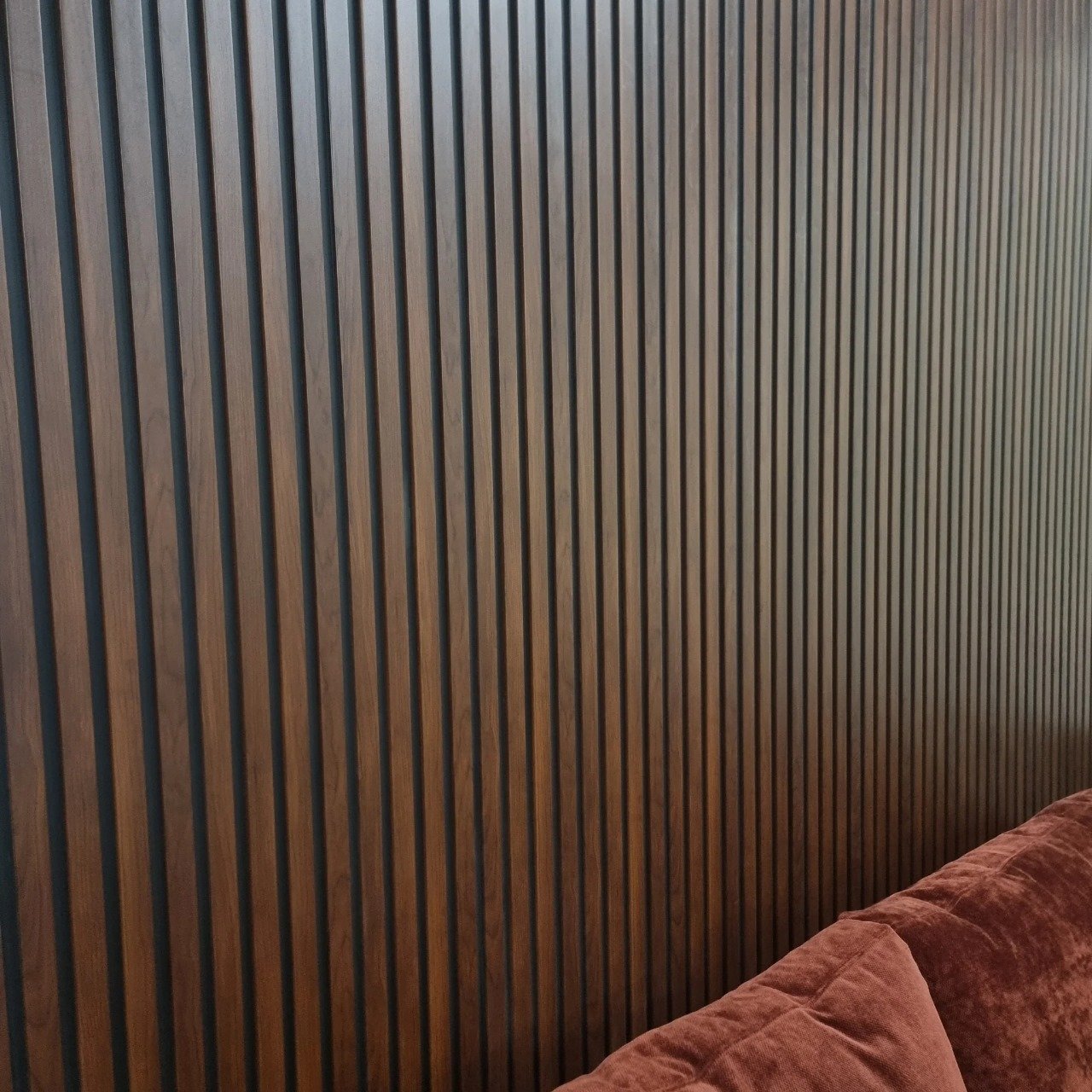 Dark oak waterproof slatted WPC wall panels 15x240cm installed in living room – Solid Furniture UK
