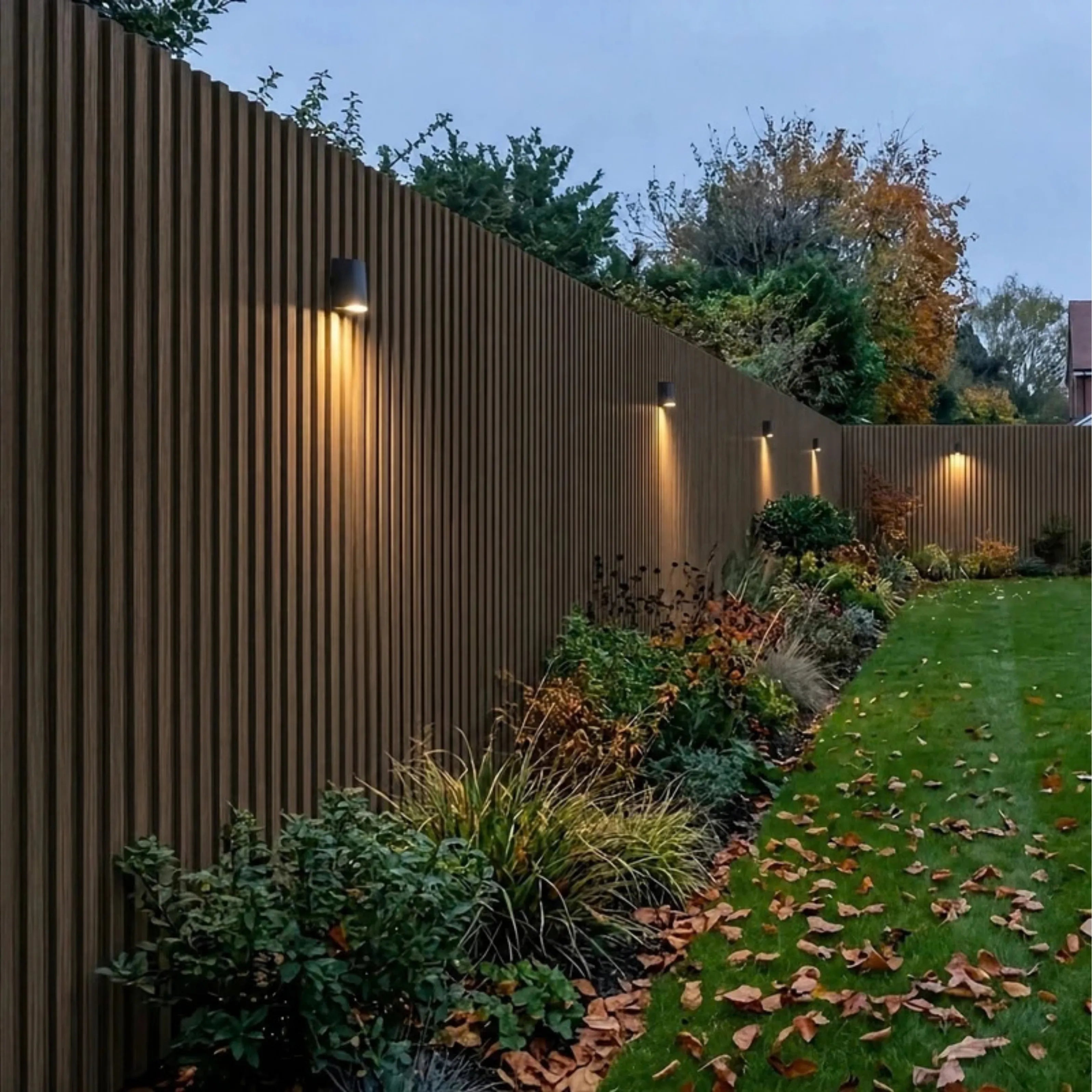 Dark oak WPC wall panels installed in a garden feature area – Solid Furniture UK
