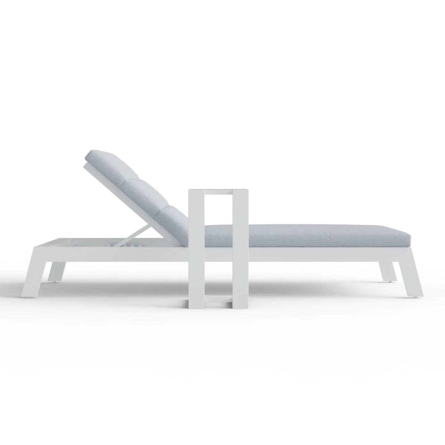 Side angle view of Dasia sun lounger with matching table showing complete outdoor set from Solid Furniture UK
