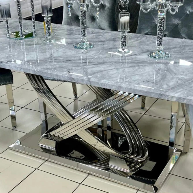 Elina grey marble dining table in 160cm and 180cm sizes with chrome base shown in full main view in a modern dining room from Solid Furniture UK