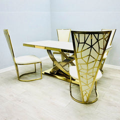White and gold Elina marble dining table styled with dining chairs, creating a bright and elegant modern dining room setup. solid furniture UK