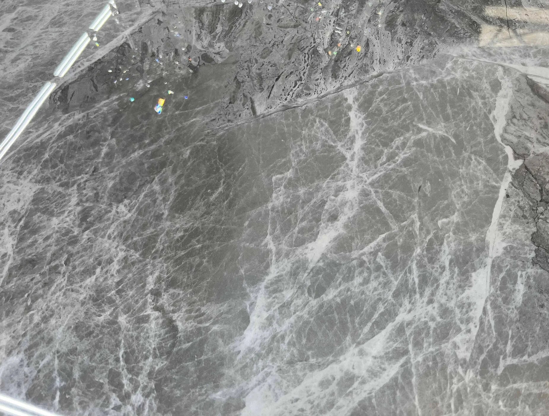 Top view of Zermatt dining table grey ceramic marble effect surface with elegant white veining and smooth finish detail