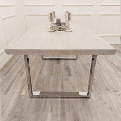 Front view of Freya 1.8m dining table UK from Solid Furniture UK showing wide solid pine wood surface and contemporary metal leg structure