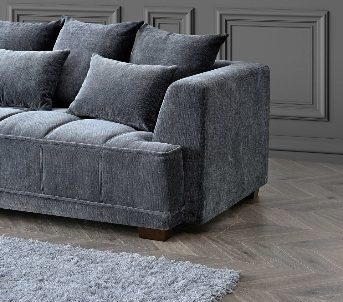 Side view of Gramercy steel grey velvet corner sofa with deep cushions and modern design Solid Furniture UK