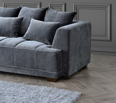 Side view of Gramercy steel grey velvet corner sofa with deep cushions and modern design Solid Furniture UK