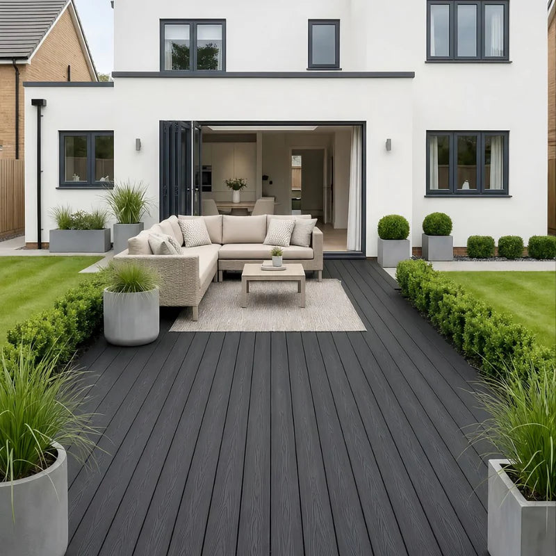 Grey 290cm composite decking installation at the front of a UK home by Solid Furniture UK