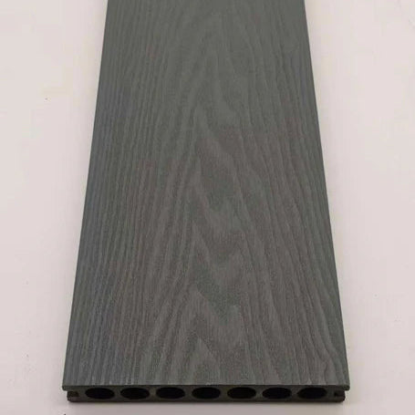 Grey 290cm composite decking boards installed in a modern outdoor space by Solid Furniture UK