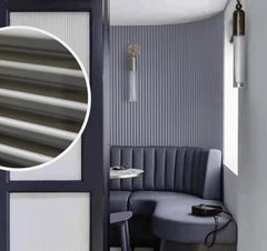 Grey fluted WPC wall panels installed on a living room feature wall by Solid Furniture UK creating a modern interior design look