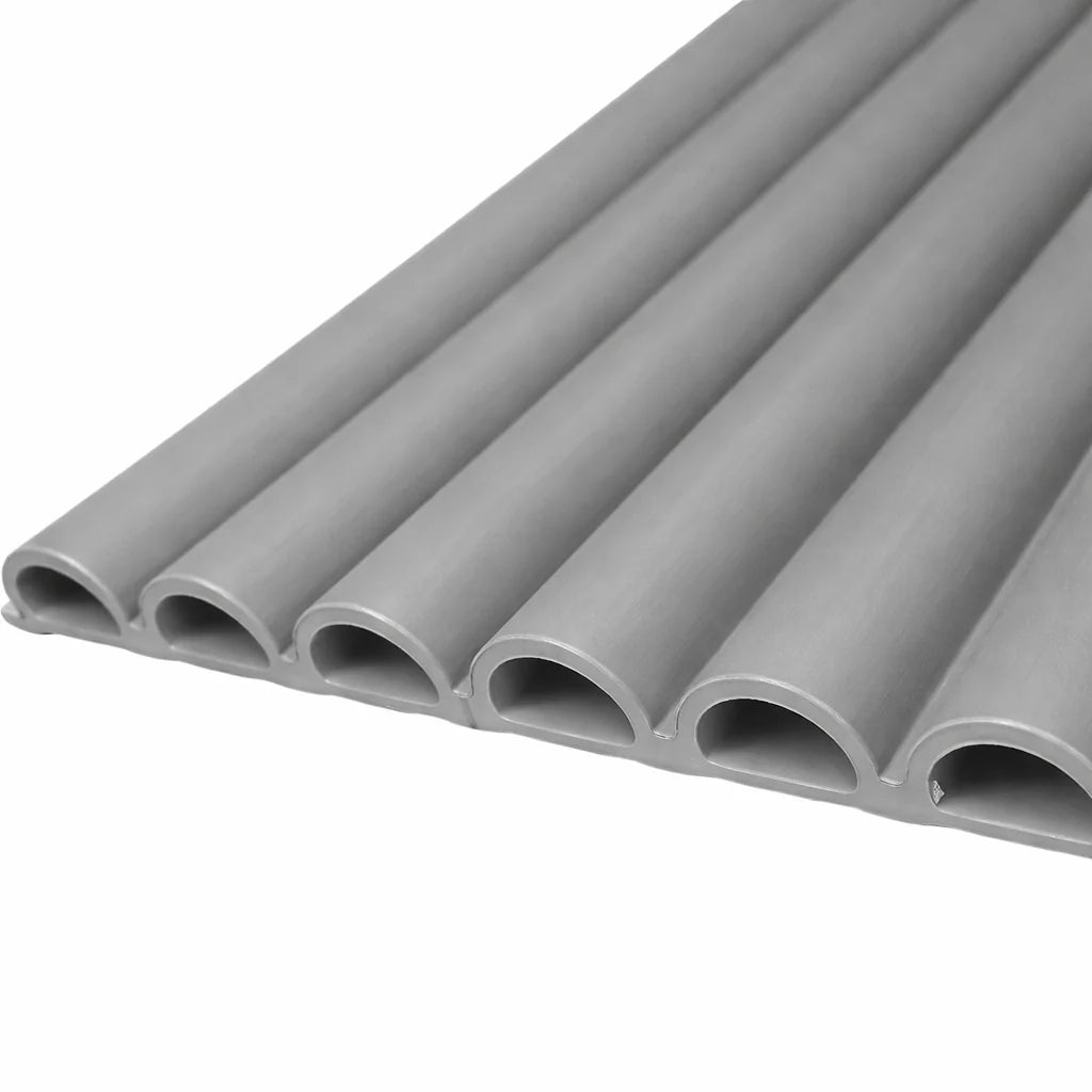 Close-up view of grey fluted WPC wall panels from Solid Furniture UK showing textured vertical groove design and premium finish