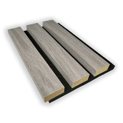 Close-up of Grey Oak acoustic wall panel showing real wood veneer slats wrapped on three sides with premium finish and acoustic felt detail. solid furniture UK