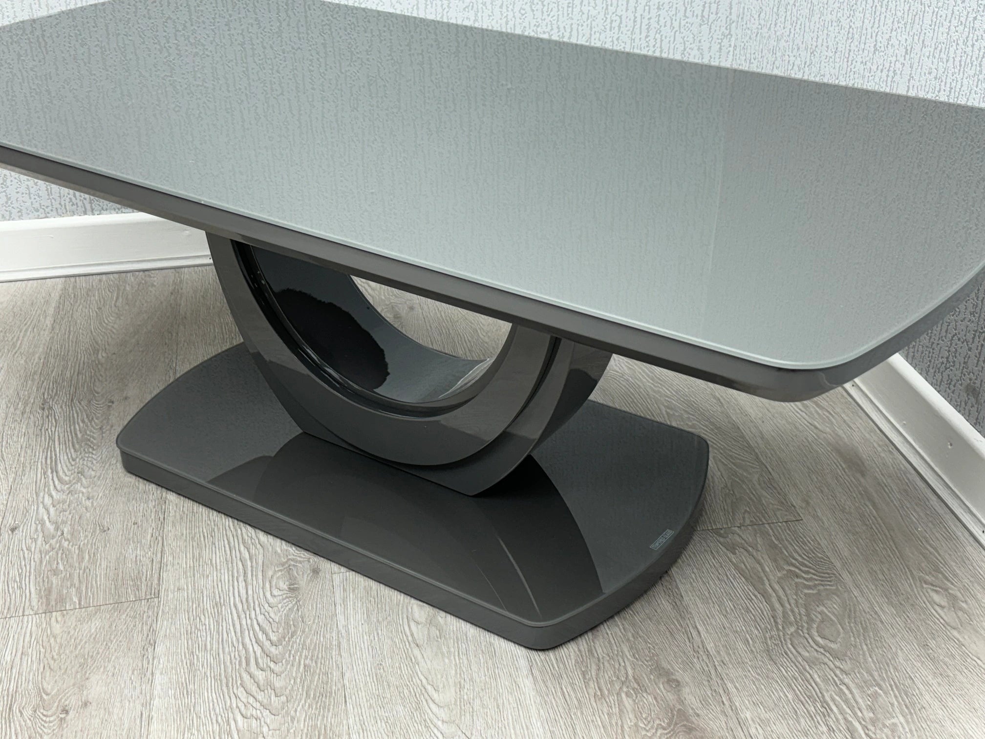 Grey Texas coffee table side view with high gloss top and U-shaped base | Solid Furniture UK