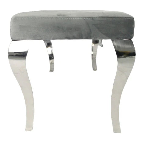 Side view of grey velvet dining bench showing structure, padding and chrome detailing at Solid Furniture UK